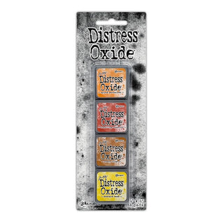 Packaging of Distress Oxide ink pads with four different colors on a white background.