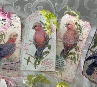 Use the Pink Galah paper Napkin to create a pretty mixed media tag! The same we created at our October 2022 Creative Day. Using stamping, stencilling techniques plus some lace, seam binding and the Free Art Quote Printable.